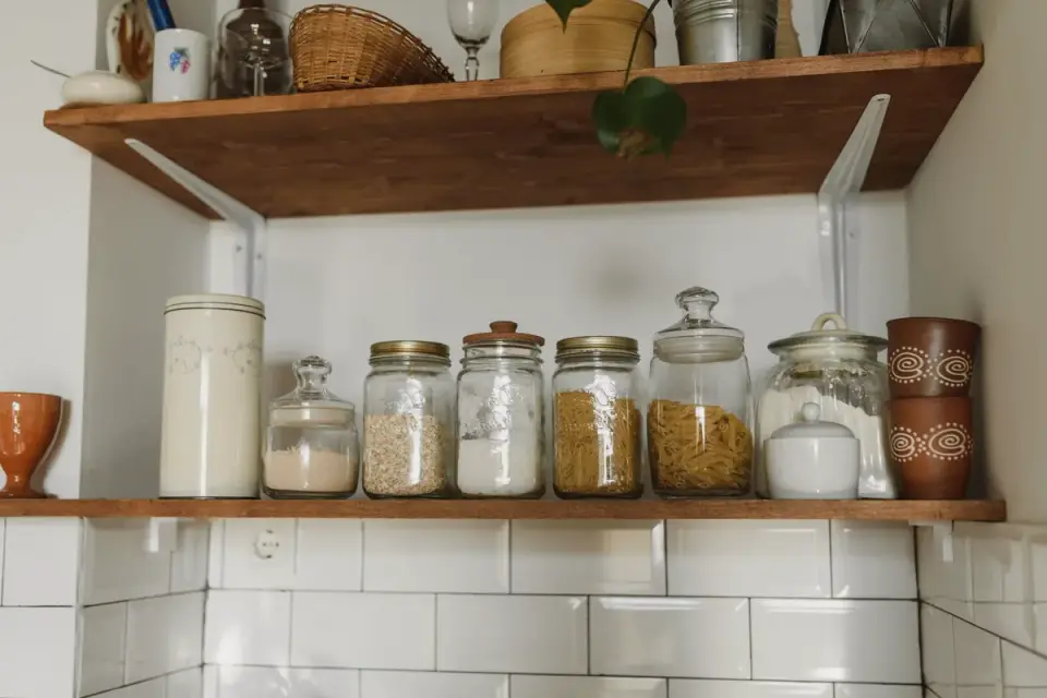 A sealed container of leftover wet dog food stored in a refrigerator