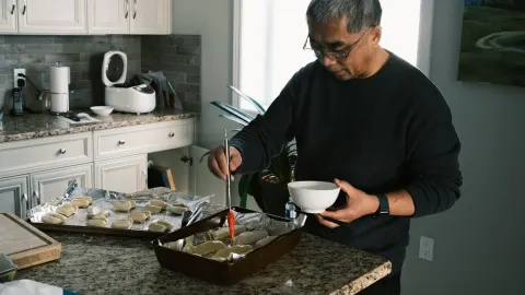 Dog owner preparing a meal